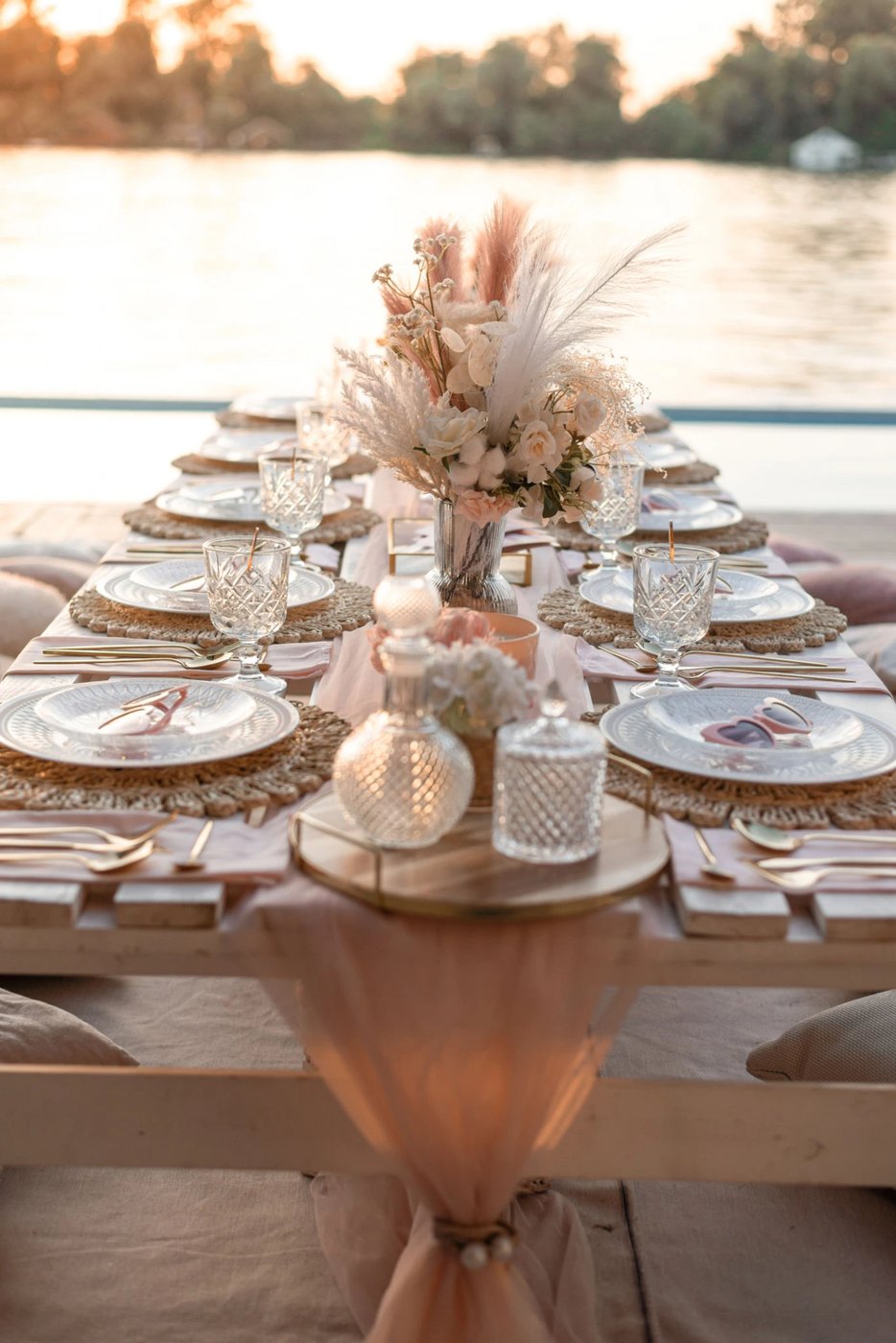 Real Enchanting Escapes lakeside tablescape at golden hour